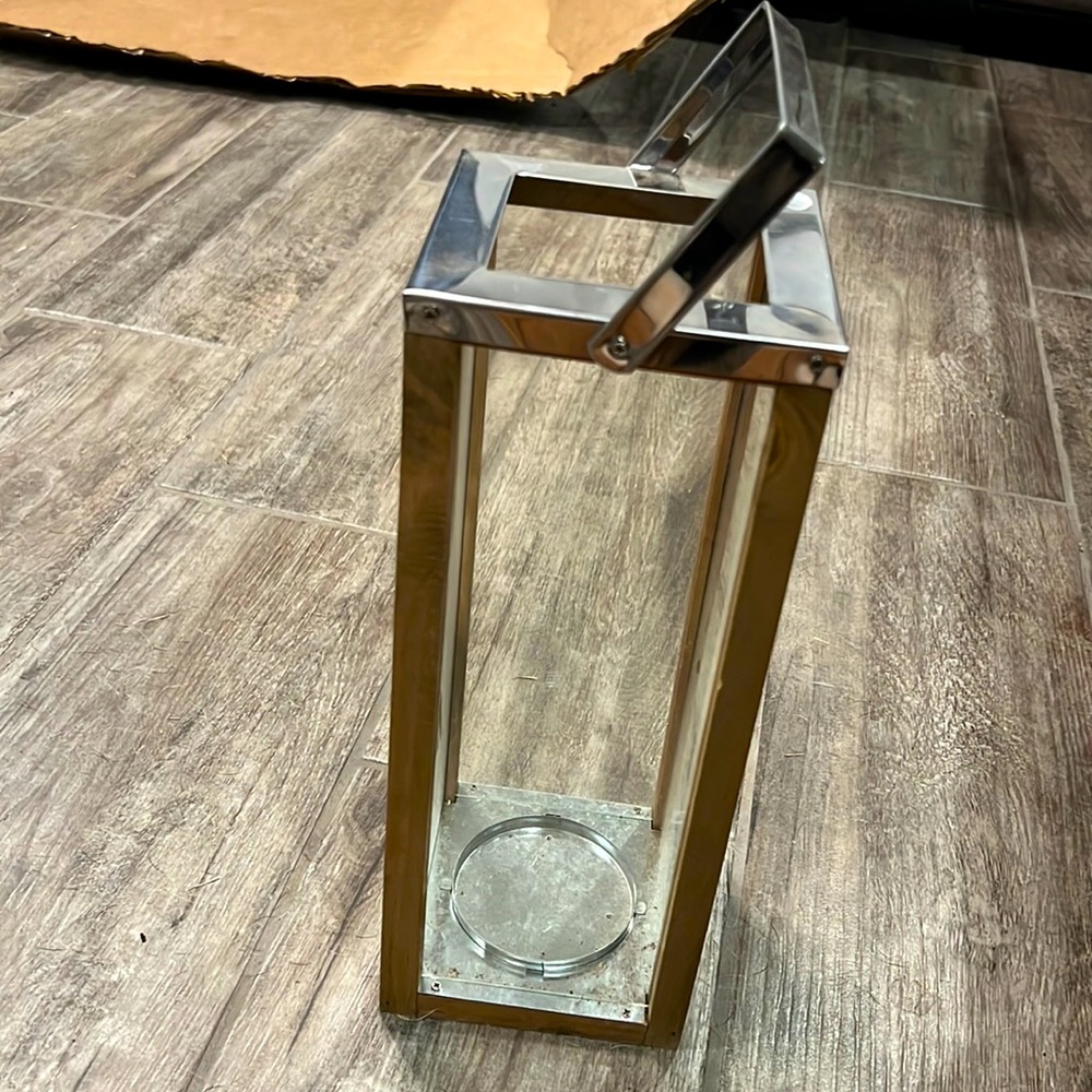 Tall wooden and metal glass lantern.